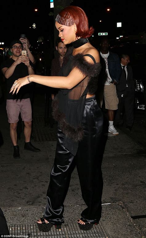 rihanna suffers a double nip slip as she goes braless and displays