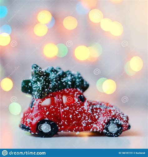 red car  christmas tree  roof  bright lights background