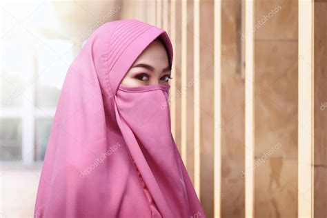 muslim woman wearing face covering stock photo  leolintang