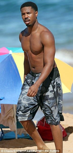 michael b jordan takes plunge while paddleboarding in maui daily mail online