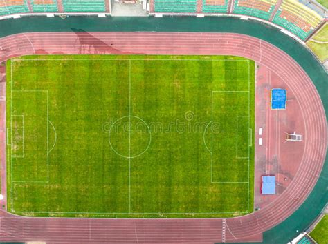 flying  drone   modern football field view   manicured lawn   stadium