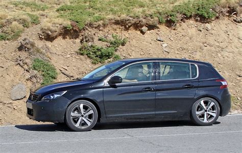 peugeot  facelift spied   camouflage expect    autoevolution