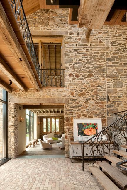 modern redesign   country home  antique stone walls  exposed ceiling beams