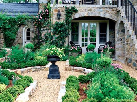 stone house  lots  plants  flowers   front yard    outdoor seating area