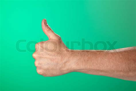 thumbs   signal  green background stock image colourbox