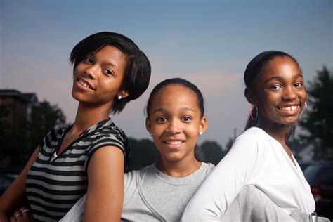 three beautiful smiling teenage african american girls