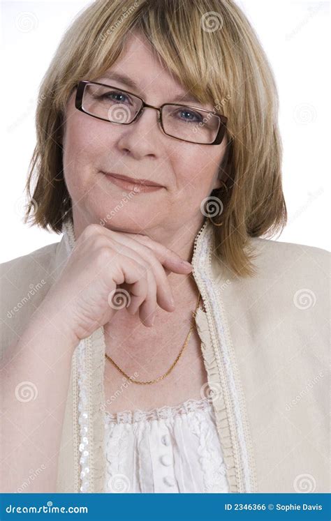 attractive middle aged woman pumping gasoline stock photography
