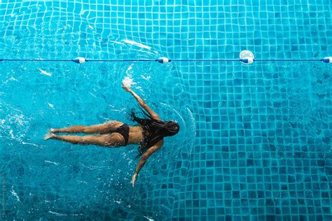 African Girl Swimming In A Swimming Pool By Stocksy Contributor Kike