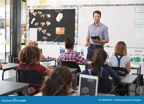 teacher  tablet  front  elementary school class stock photo image  millennials