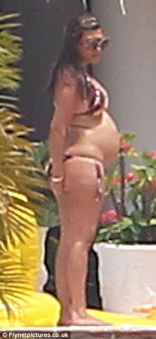 kourtney kardashian proudly shows off her bump in skimpy bikini daily mail online