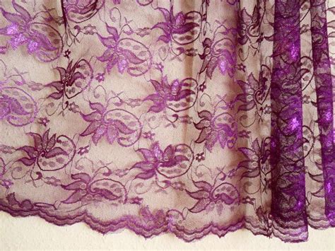 purple lace fabric  flower design wavy edge   sides purple