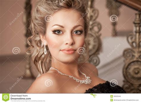 blonde woman with diamond jewelry with hairstyle and makeup royalty free stock image image