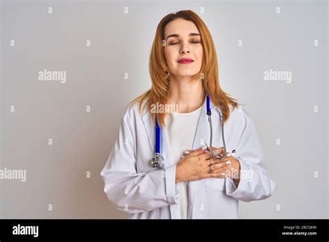Redhead Caucasian Doctor Woman Wearing Stethoscope Over Isolated