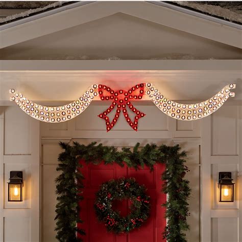 dazzling lighted swag bow country door