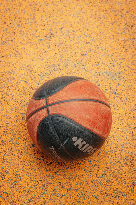 brown  black basketball  brown  black textile photo  ball image  unsplash