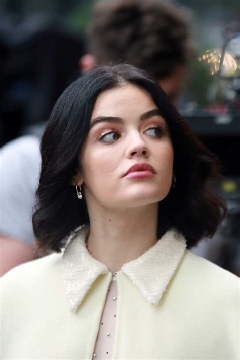 lucy hale looks all decked up in pink jacket over a black