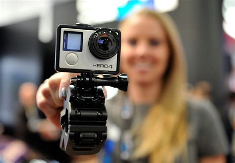 woman holding   camera  front