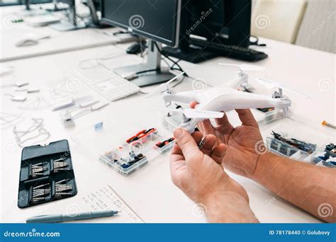 close   drone  repairman hands repair shop stock photo image  component business