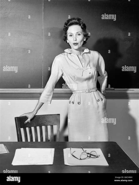 1950s Woman School Teacher Looking At Camera Standing In Front Of