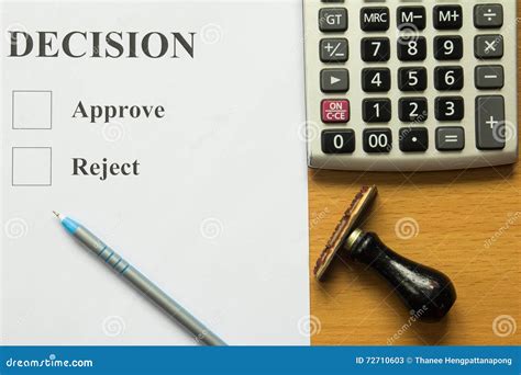 decision paper  blue  calculator  rubber stamp stock image