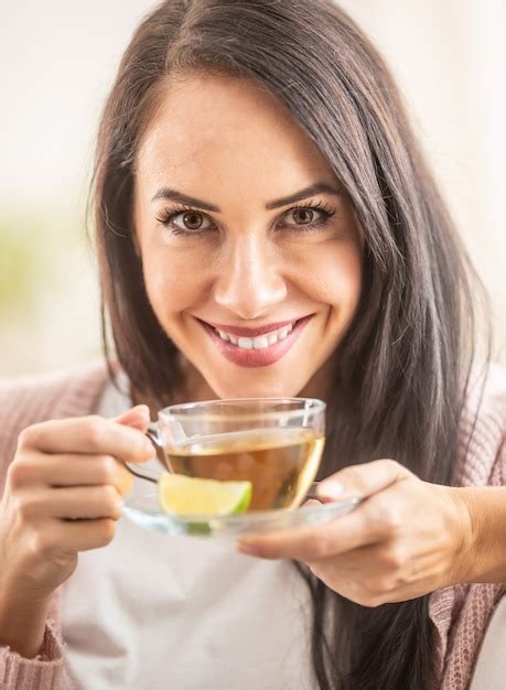 Premium Photo Cute Girl Enjoys A Cup Of Hot Tea