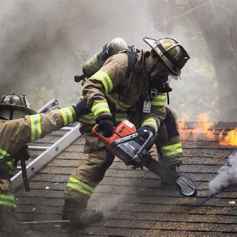 firefighter ventilating  roof   chainsaw firefighter training firefighter paramedic
