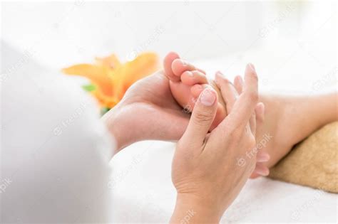 thai foot massage with aroma therapy and reflexology premium photo