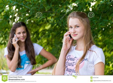 Teen Girls Talking On Cell Phone Stock Image Image 35197581