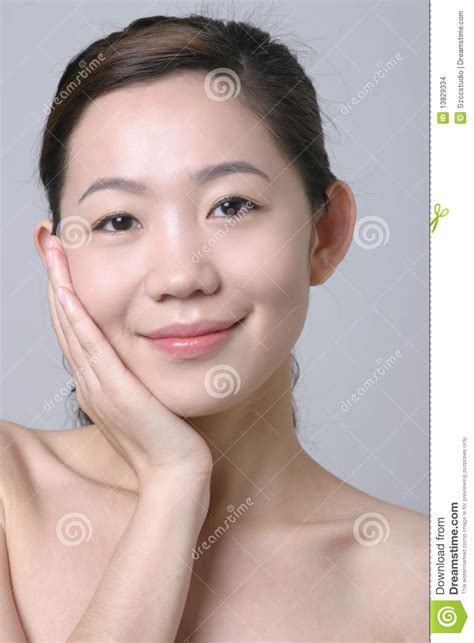 smiling asian girl with a hand touch her face stock images image 13829334