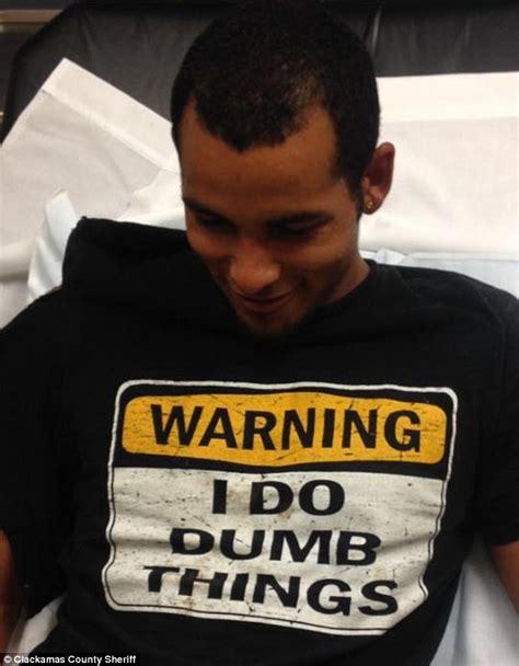 roshawn garrett arrested while wearing a warning i do dumb things t