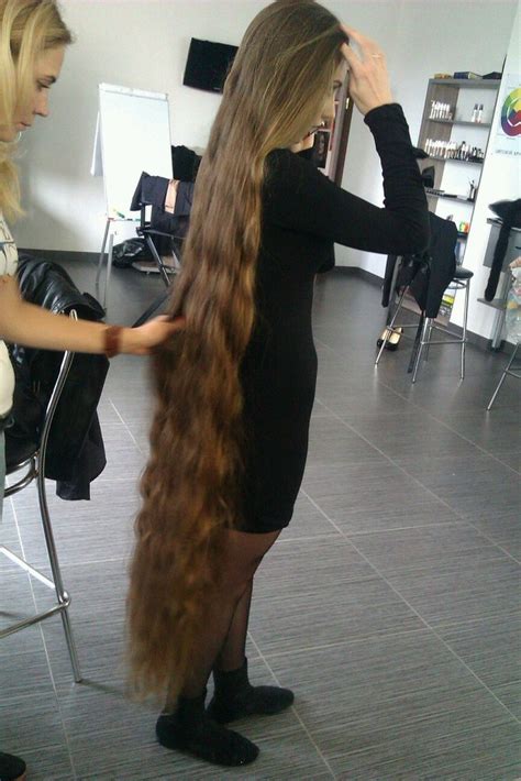 long hair girl shows off her floor length hair girls with very long hair