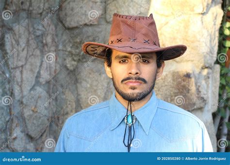 mexican cowboy wearing hat  denim shirt stock photo image  outdoors portrait