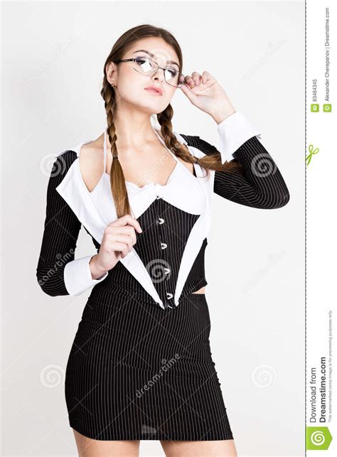 secretary portrait of beautiful brunette business lady with glasses and wearing in pinstripe