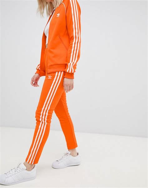 adidas originals rechte broek met drie strepen  oranje  het oranje lyst nl