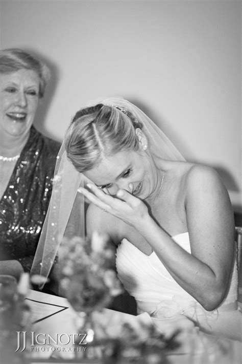 the newly married bride is moved to tears by the kind words her friends