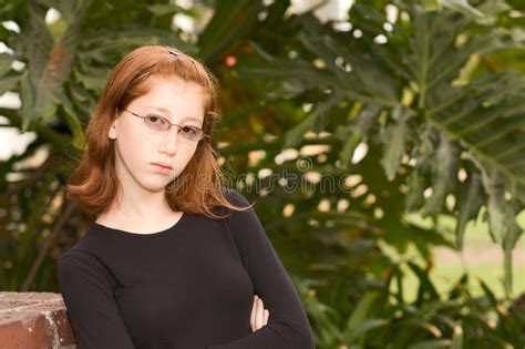 Outdoor Portrait Of Redhead Teen Girl In Glasses Stock