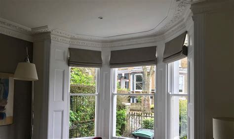 roman blinds fitted   window bay rascal roses