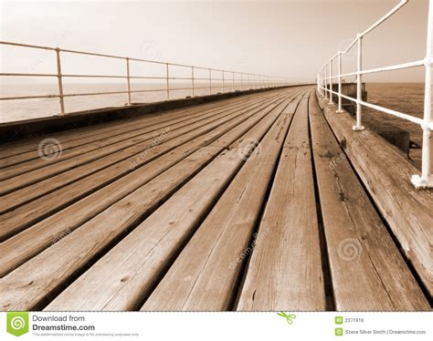 pier boardwalk stock photo image  sepia vanishing
