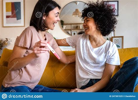Smiling Young Woman Shows Girlfriend Positive Pregnancy Test Happy
