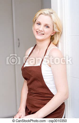 sexy housewife a sexy blonde housewife in apron canstock