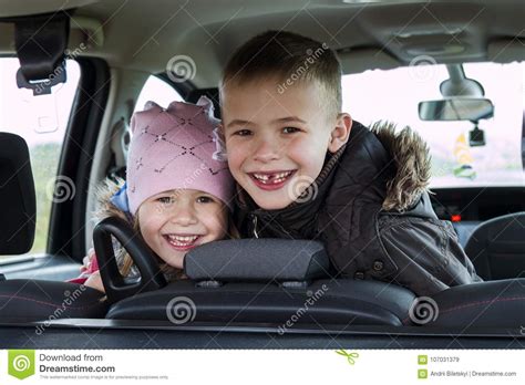 pretty  children boy  girl   car interior stock image