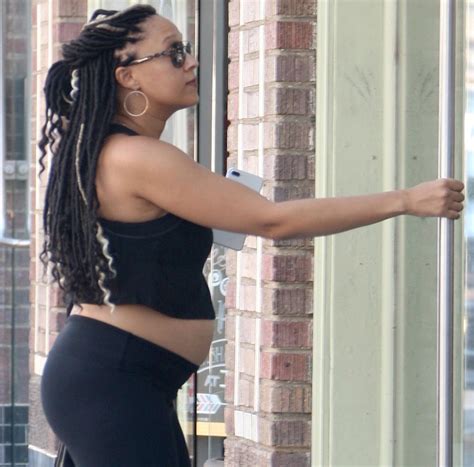 tia mowry steps out with her pregnant belly exposed photos