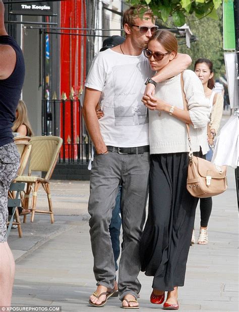 Jenson Button And Jessica Michibata Walk Straight Past His