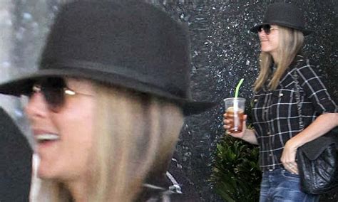 jennifer aniston can t hide her smile as she hits the spa