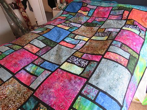 people have been making colorful stained glass quilts for sale and they look beautiful