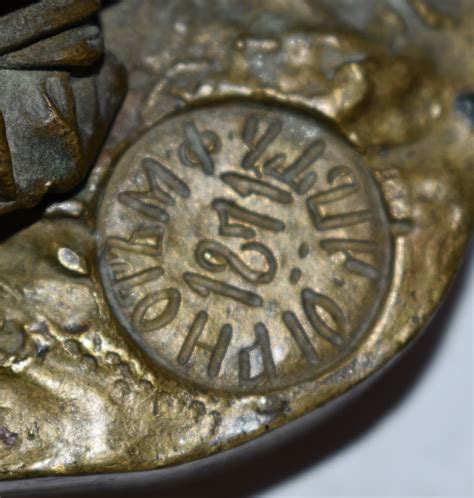 brass figure  markings antiques board