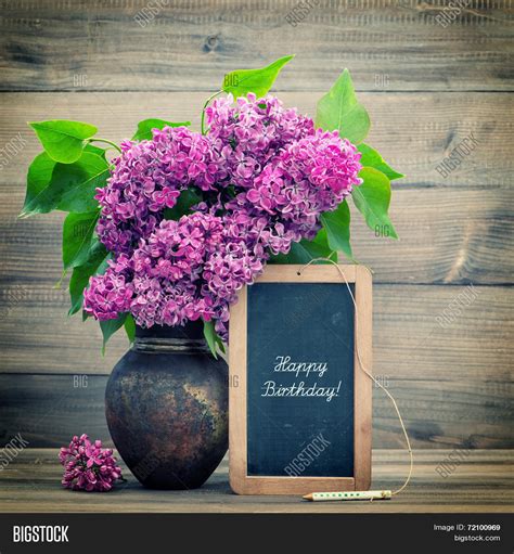 bouquet  lilac flowers blackboard  text happy birthday stock