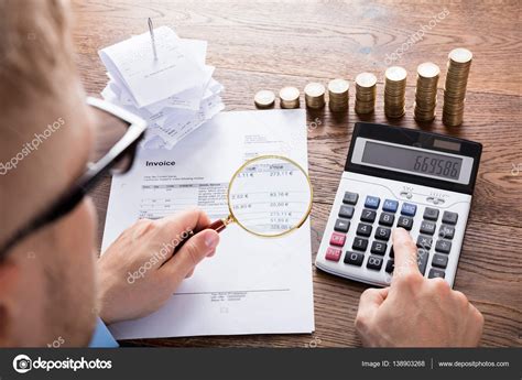 person calculating invoice  desk stock photo  candreypopov