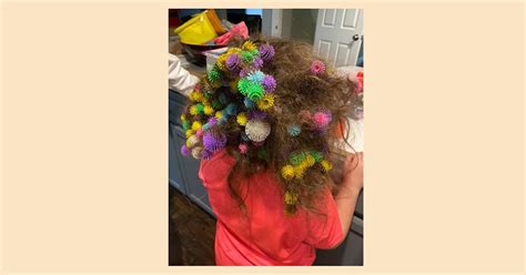 girl gets 150 bunchem balls stuck in hair and goes viral