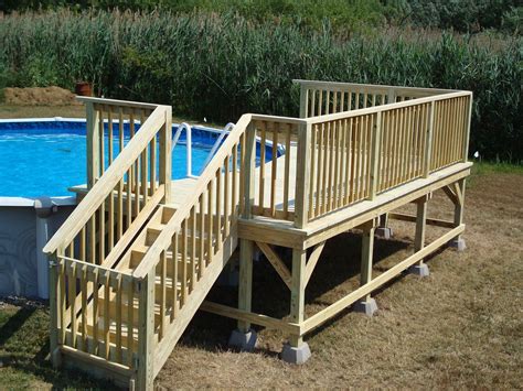 An Above Ground Swimming Pool With Stairs Leading Up To The Deck And